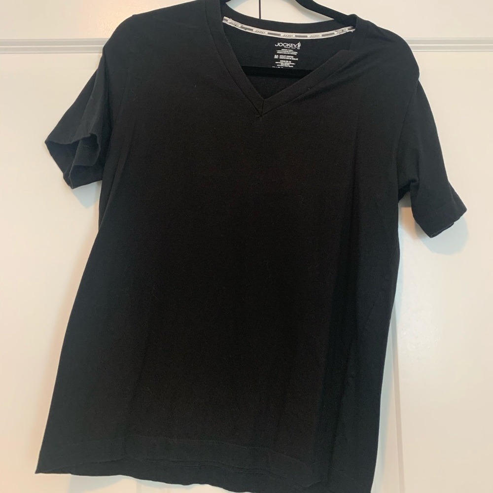 Plain black tee. Fits like a large